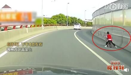 社会万象男孩独自骑童车上高架 热心市民报警后一路护送